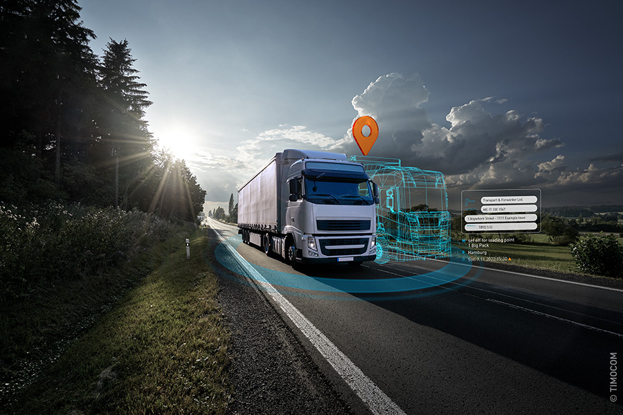 Truck riding on a road with a digital twin next to it